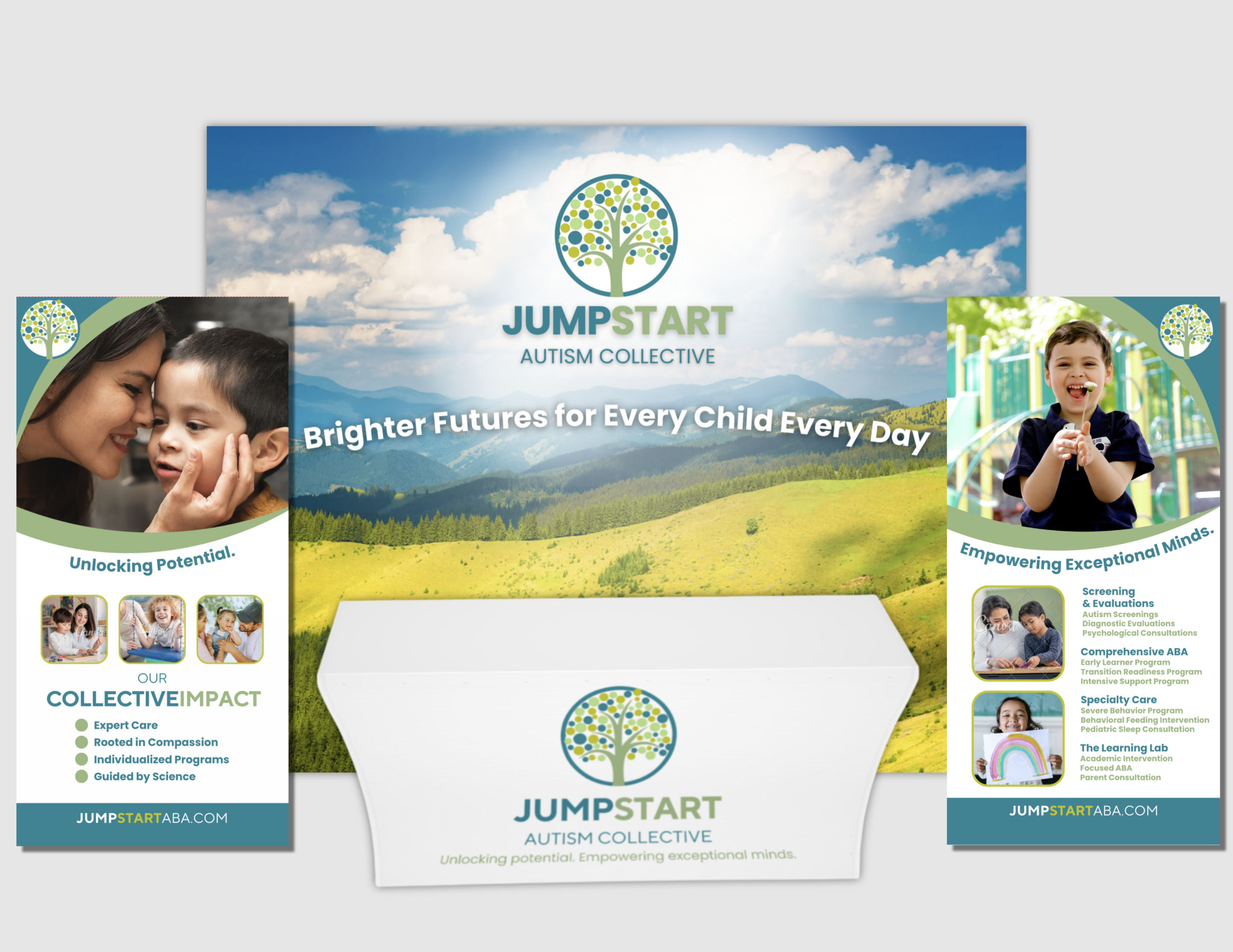 Jumpstart Autism Collective event booth with a mountain meadow backdrop, two banners and a branded table