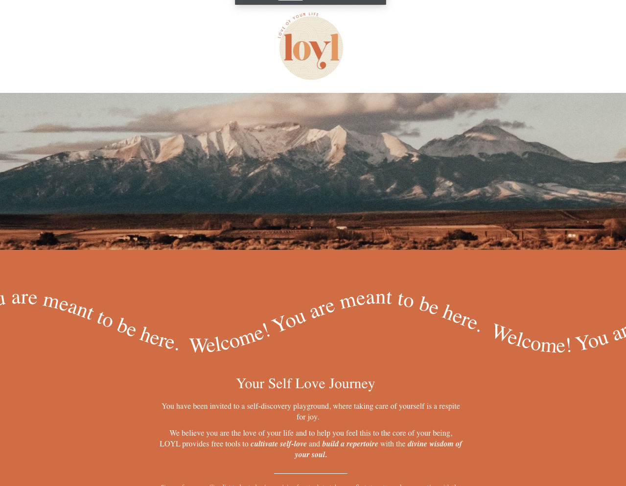 LOYL website with snowy mountains above a terracotta panel of curving welcome text