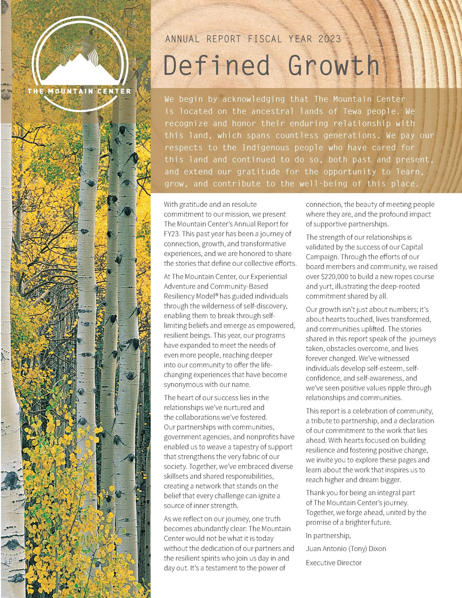 Opening page of the FY2023 annual report, Defined Growth, framed by golden aspens